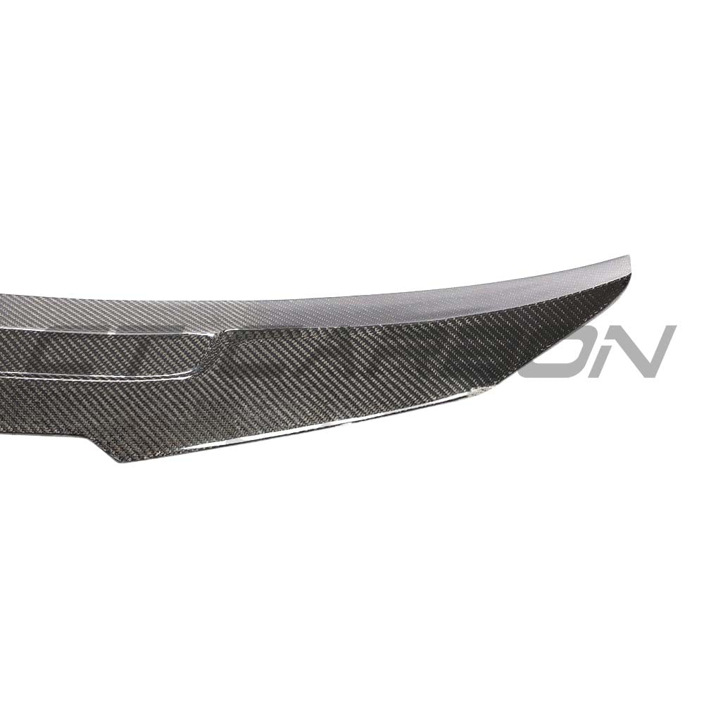 Carbon fibre spoiler for Audi A5/S5 B9 Coupe by CT Carbon, showcasing sleek, aerodynamic design on a black car with a sporty look.