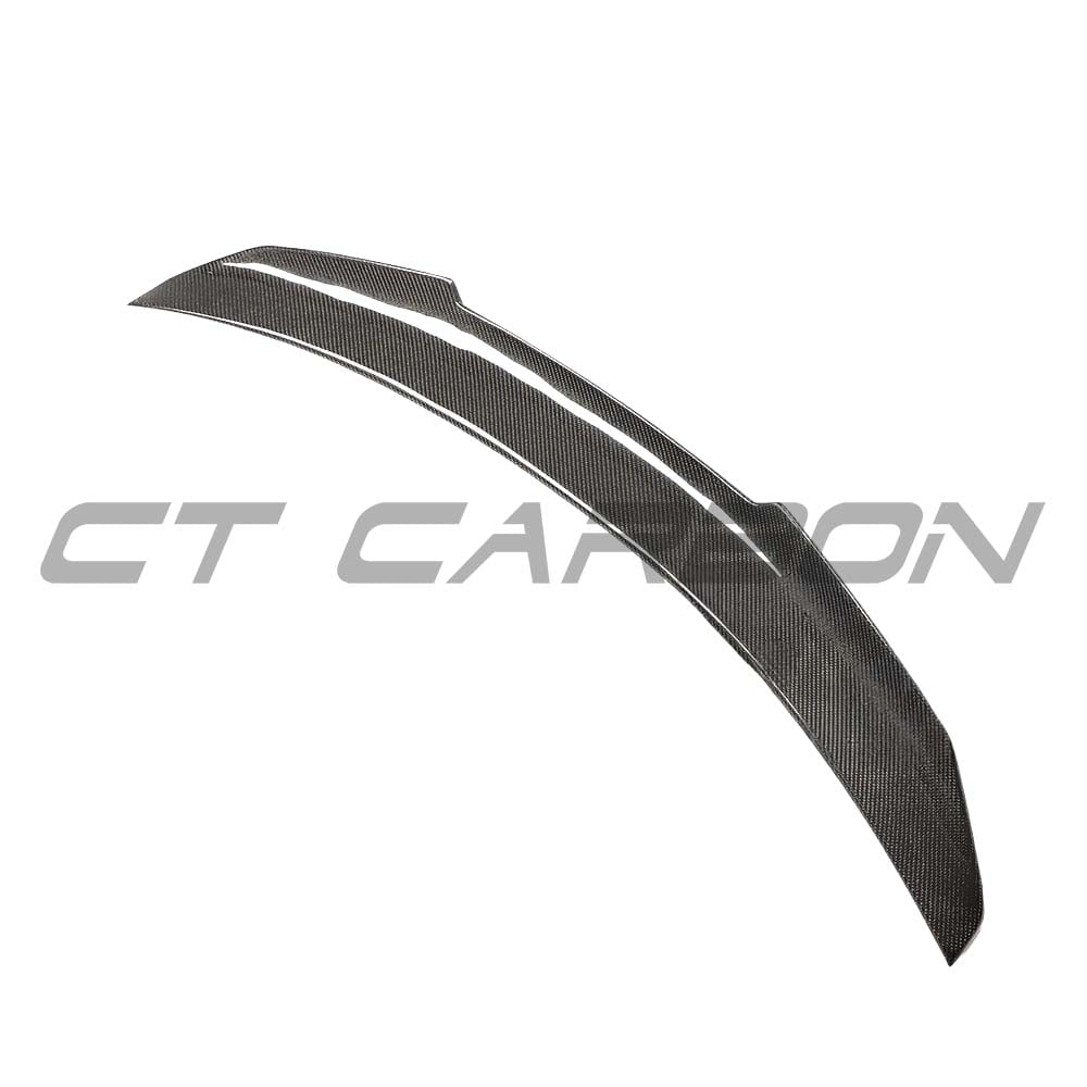A black carbon fiber spoiler for Audi A5/S5 B9 Coupe by CT Carbon, mounted on the rear of a 2017-2021 model.