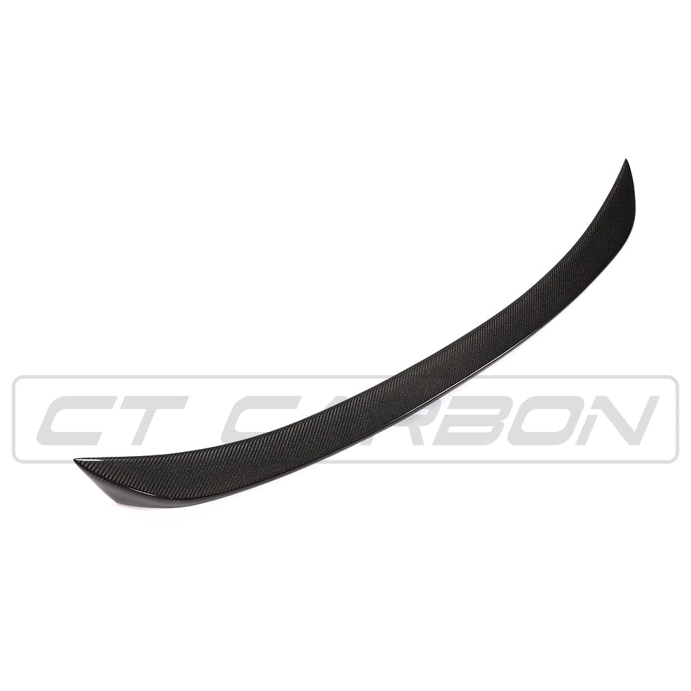 BMW F10 M5 carbon fiber spoiler by CT Carbon, V-style design, mounted on the rear of the 5 Series car.
