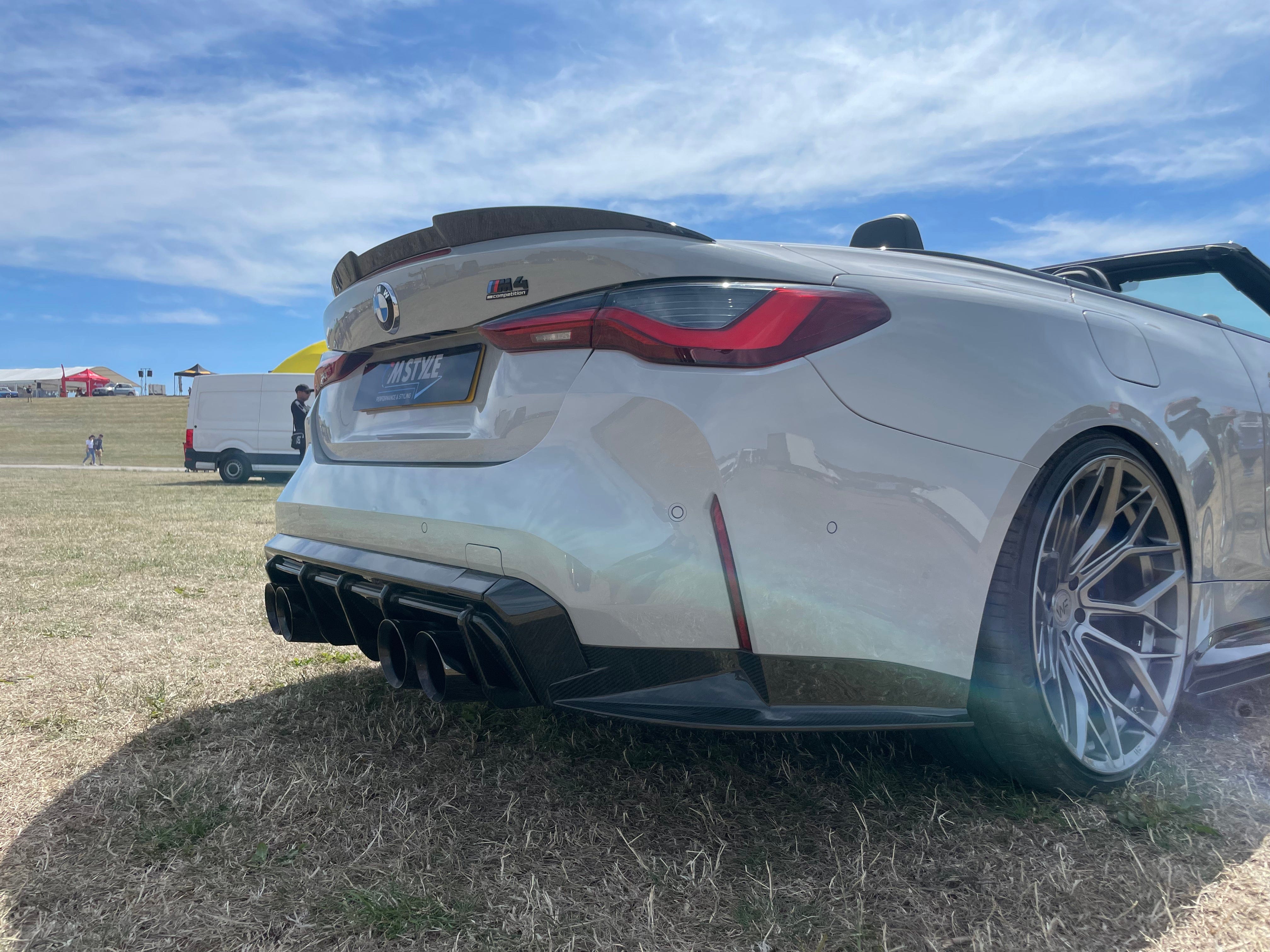BMW M4 G83 G23 Carbon Fibre Spoiler by CT Carbon, showcasing sleek aerodynamic design on a high-performance sports car.