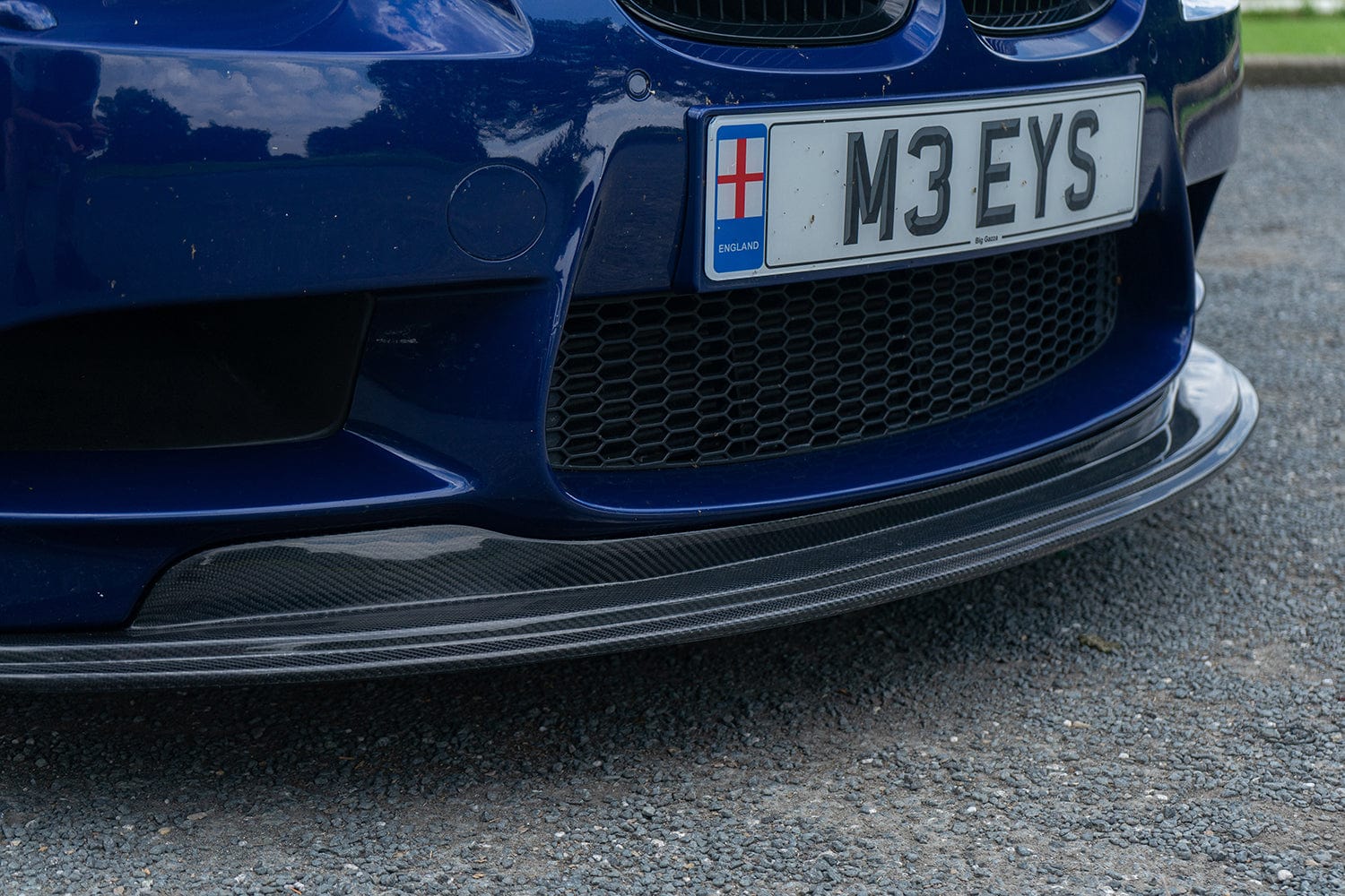 BMW M3 E92/E90 carbon fibre splitter by CT Carbon, GTS style, showing the sleek aerodynamic design and textured carbon finish.