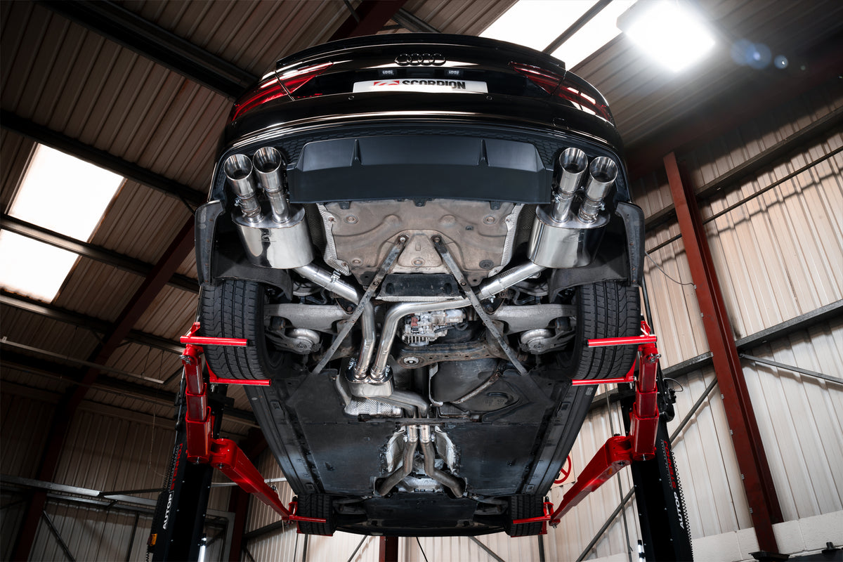 Scorpion Audi S6/S7 C7 resonated half exhaust system with electronic valves, showing polished metal piping and valve controls.
