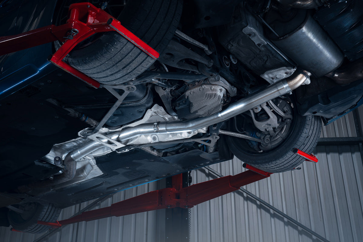 Scorpion BMW M2 F87 OEM resonator delete pipe, non-GPF model, showing the polished metal exhaust resonator delete component.
