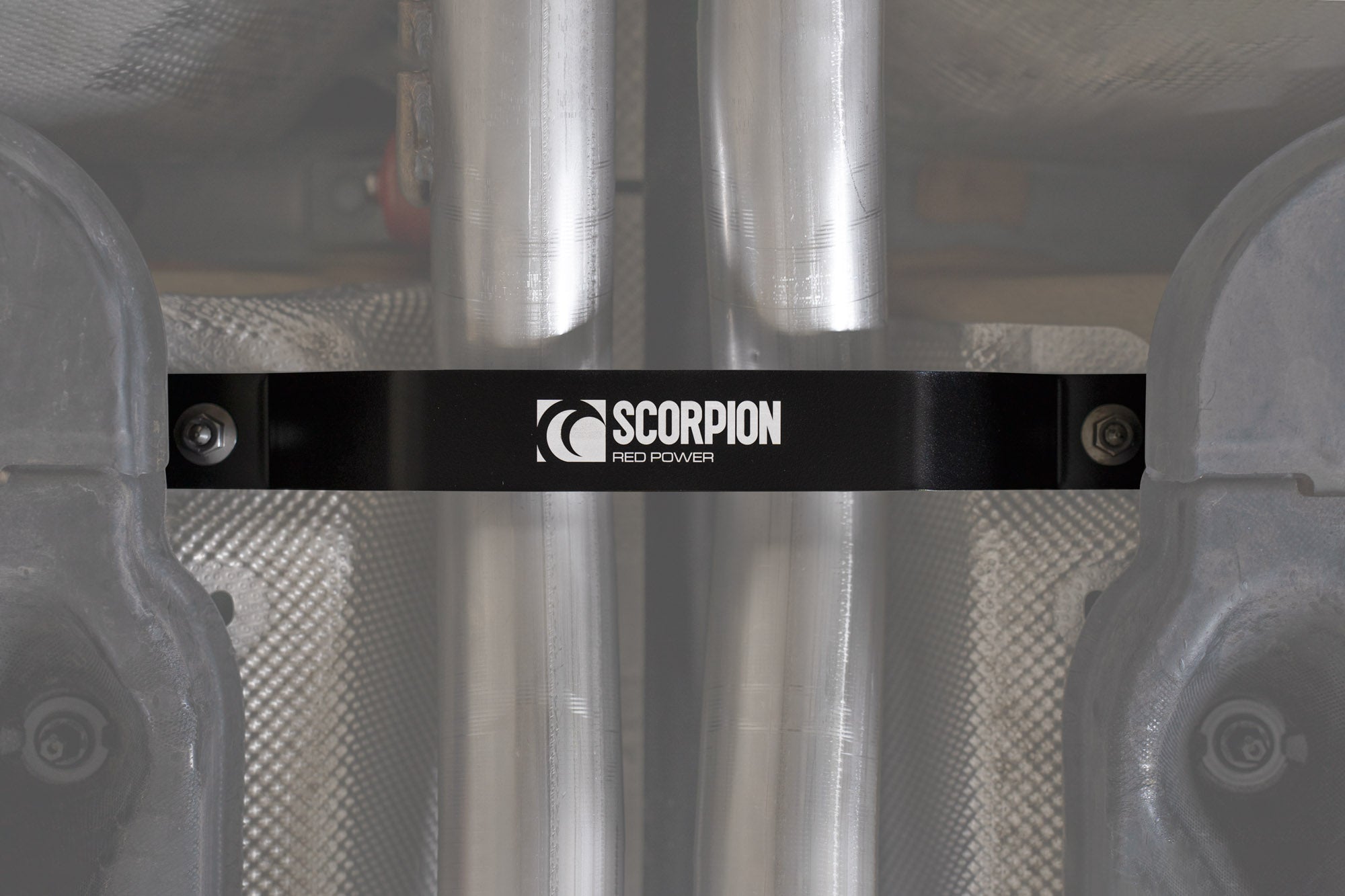 Scorpion Audi RSQ3 (F3) exhaust tunnel brace in black, showing metal construction and mounting points for engine stability.
