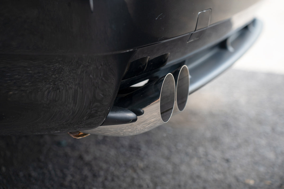 Scorpion BMW 325/328 E36 cat-back exhaust system with polished stainless steel pipes and dual exhaust tips.