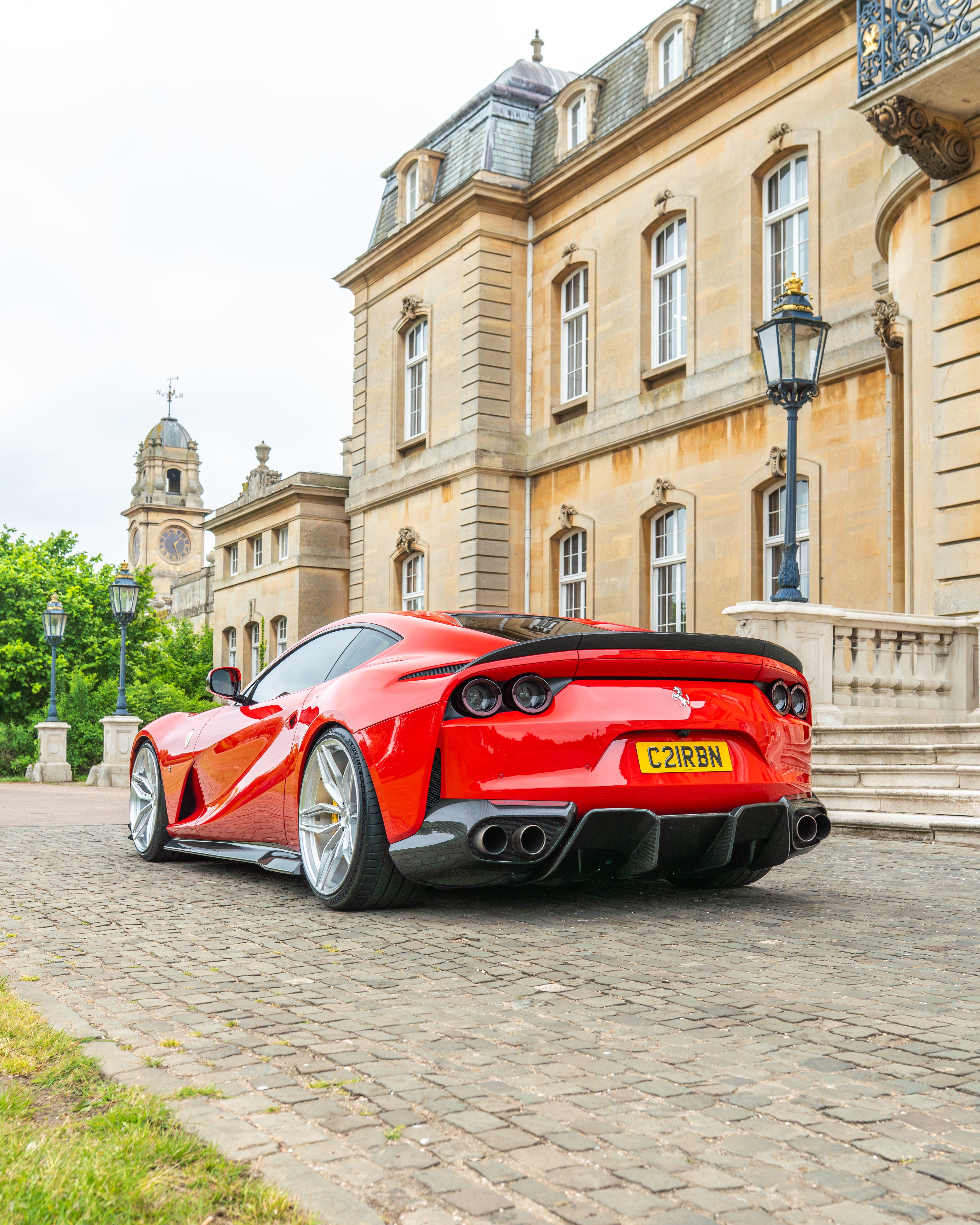 Ferrari 812 Superfast carbon fibre spoiler by CT Design, showcasing sleek aerodynamic design on a high-performance sports car.