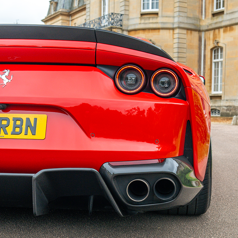 CT Carbon Ferrari 812 Superfast carbon fibre kit diffuser, showcasing detailed black carbon fibre texture and aerodynamic design.