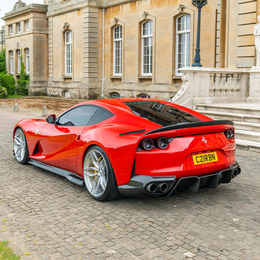 Carbon fiber spoiler for Ferrari 812 Superfast by CT Design, showcasing a sleek aerodynamic design and high-quality craftsmanship.