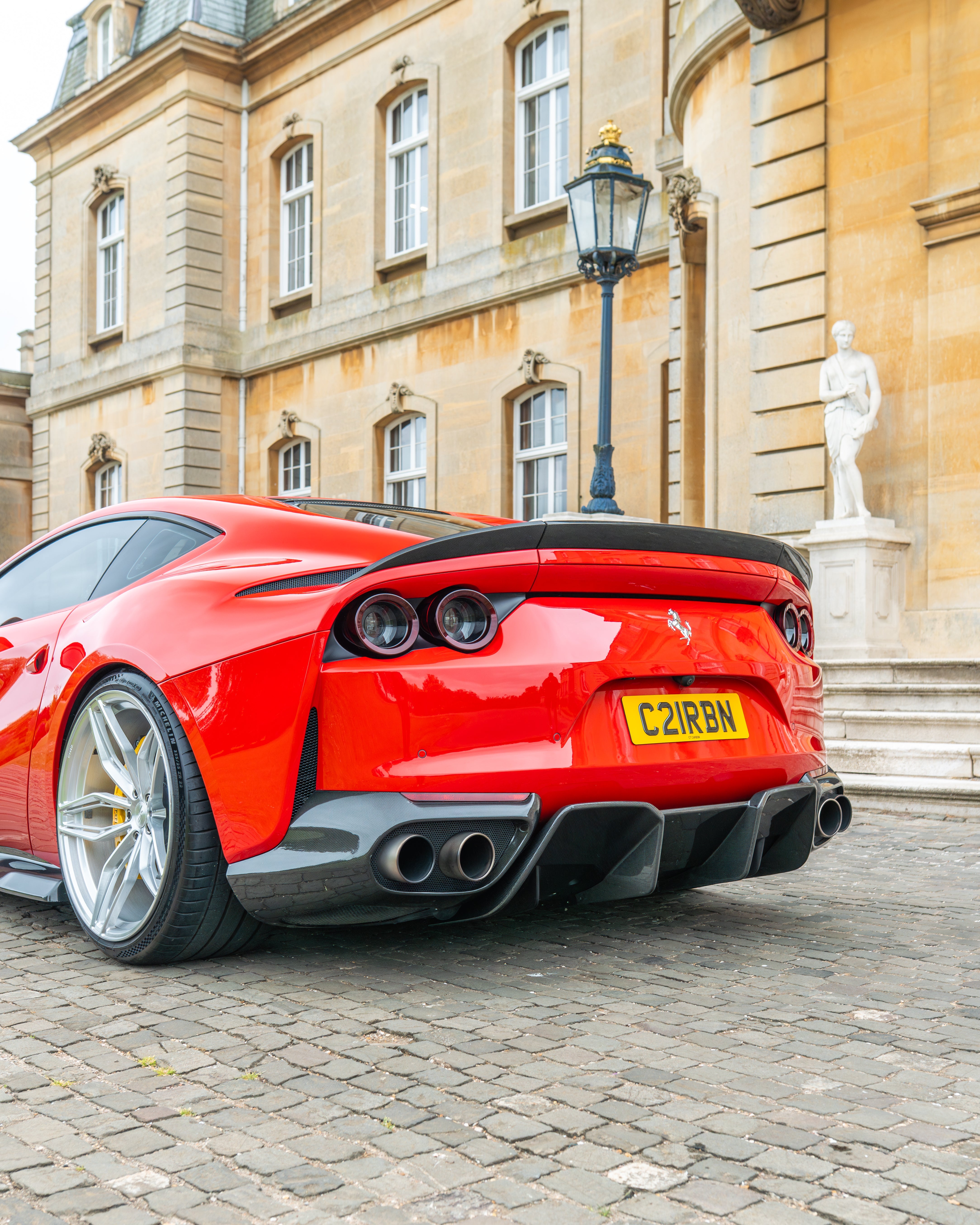 FERRARI 812 Superfast carbon fibre diffuser kit by CT Design, showing detailed black carbon fibre components.