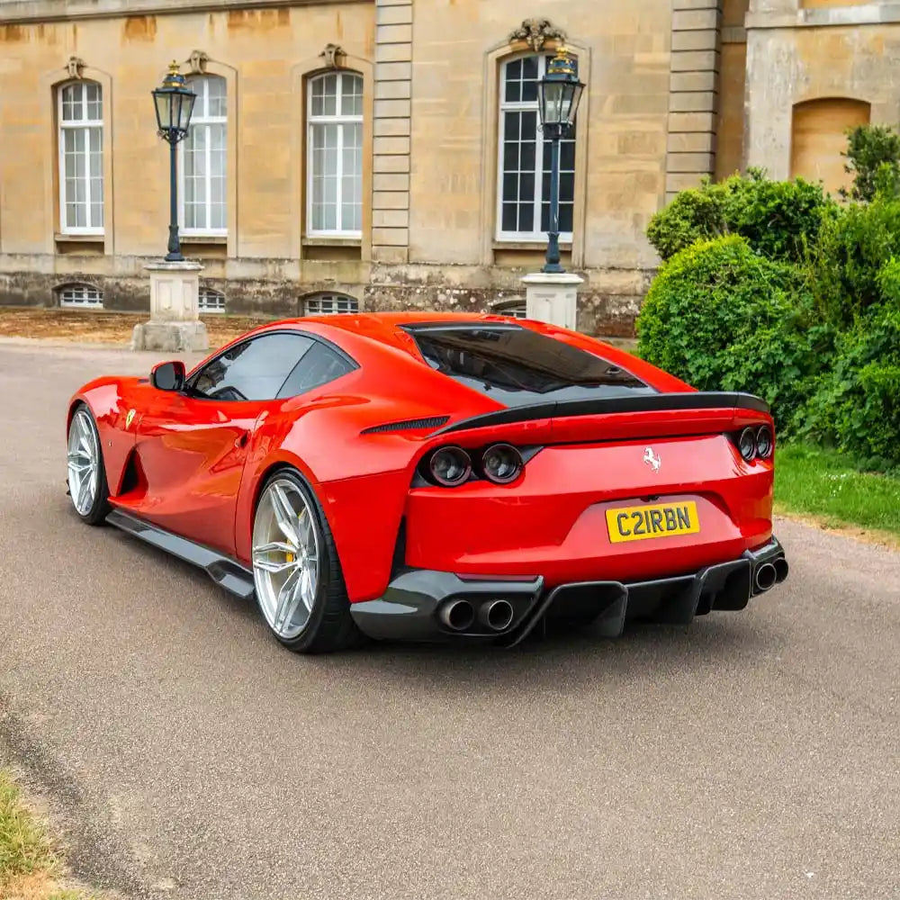 Close-up of Ferrari 812 Superfast carbon fibre diffuser by CT Carbon, showcasing its sleek, textured design for high-performance styling.