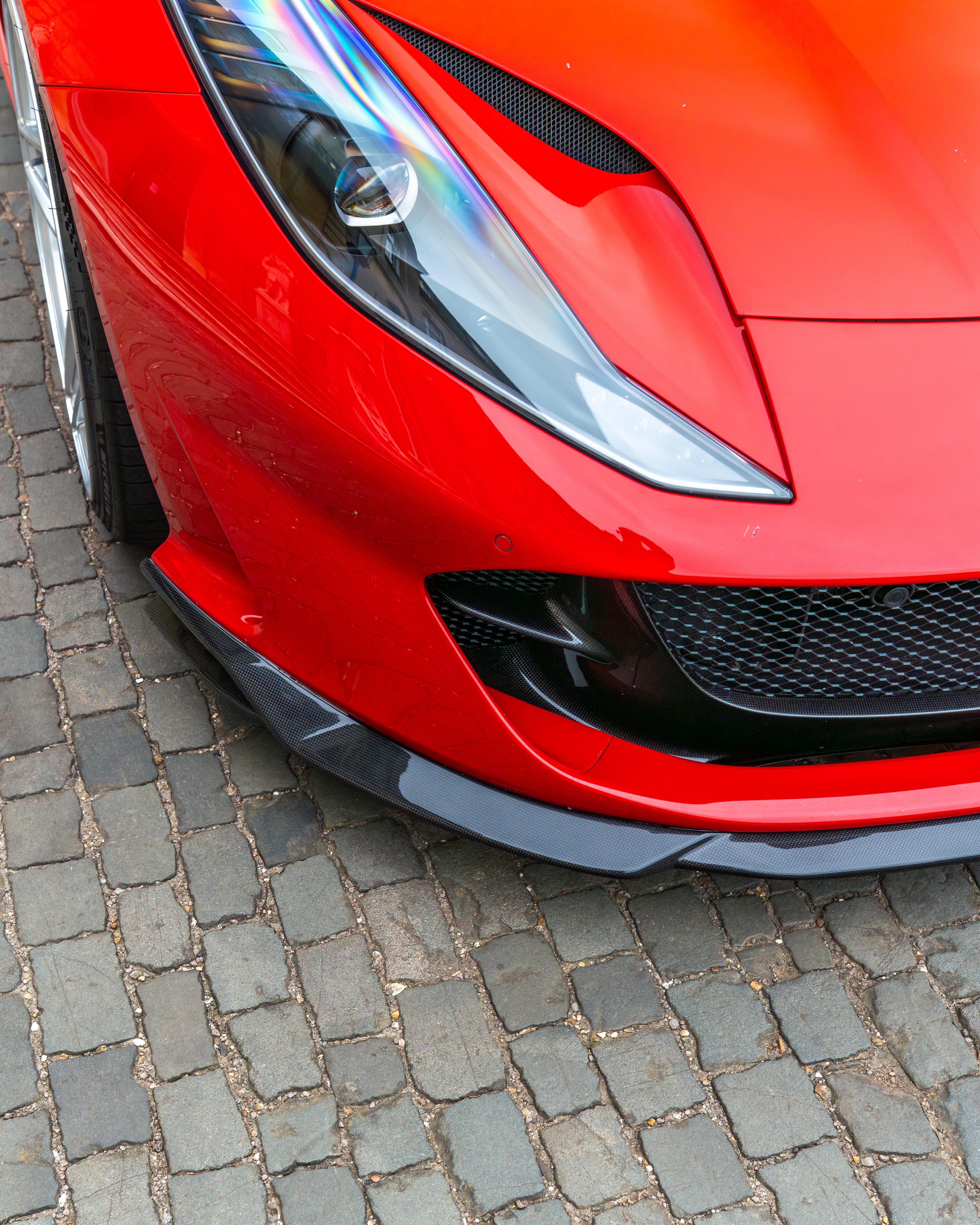 Ferrari 812 Superfast carbon fibre kit by CT Design, featuring a splitte with detailed carbon fibre finish.
