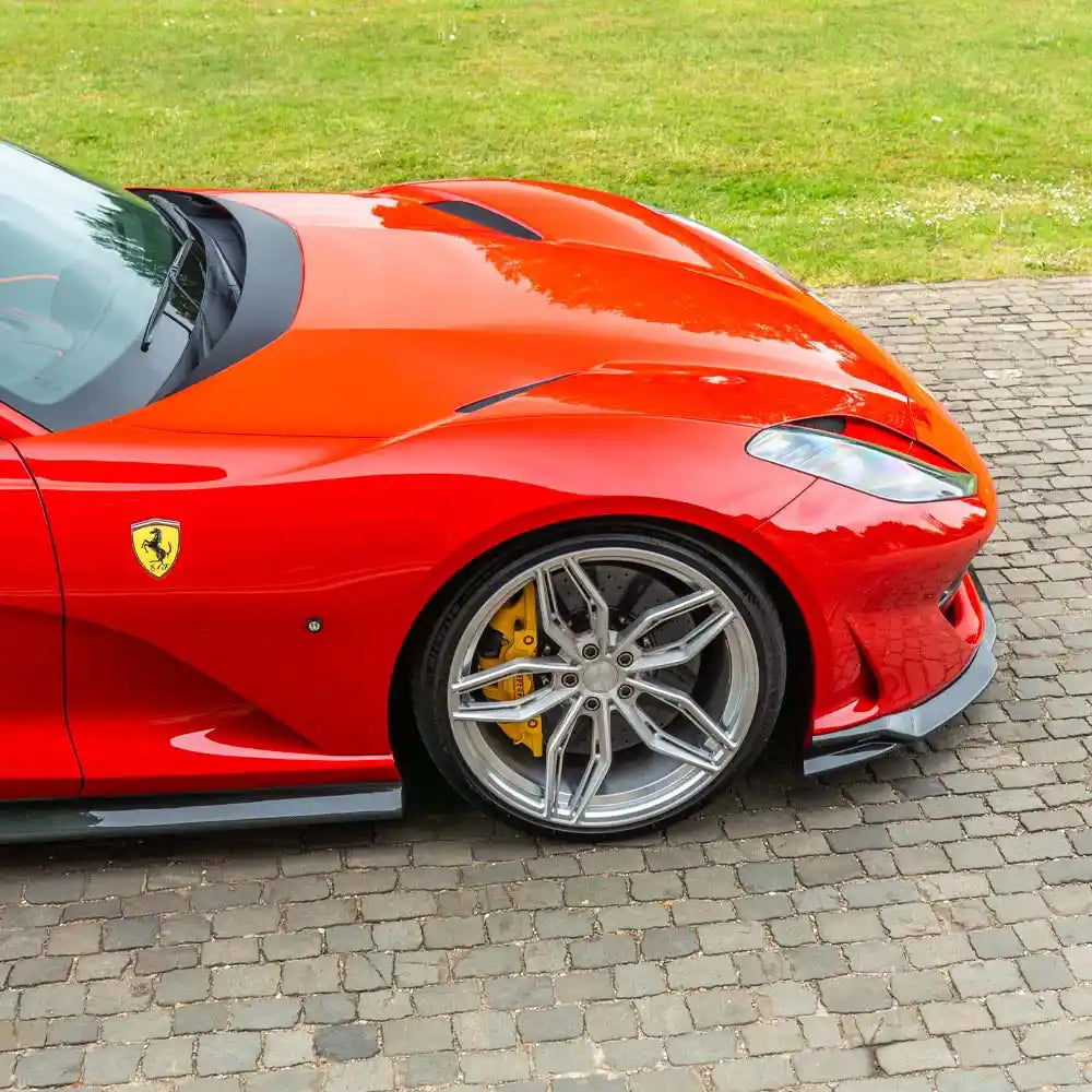 Ferrari 812 Superfast and GTS carbon fibre splitter by CT Design, showcasing sleek aerodynamic design and lightweight construction.