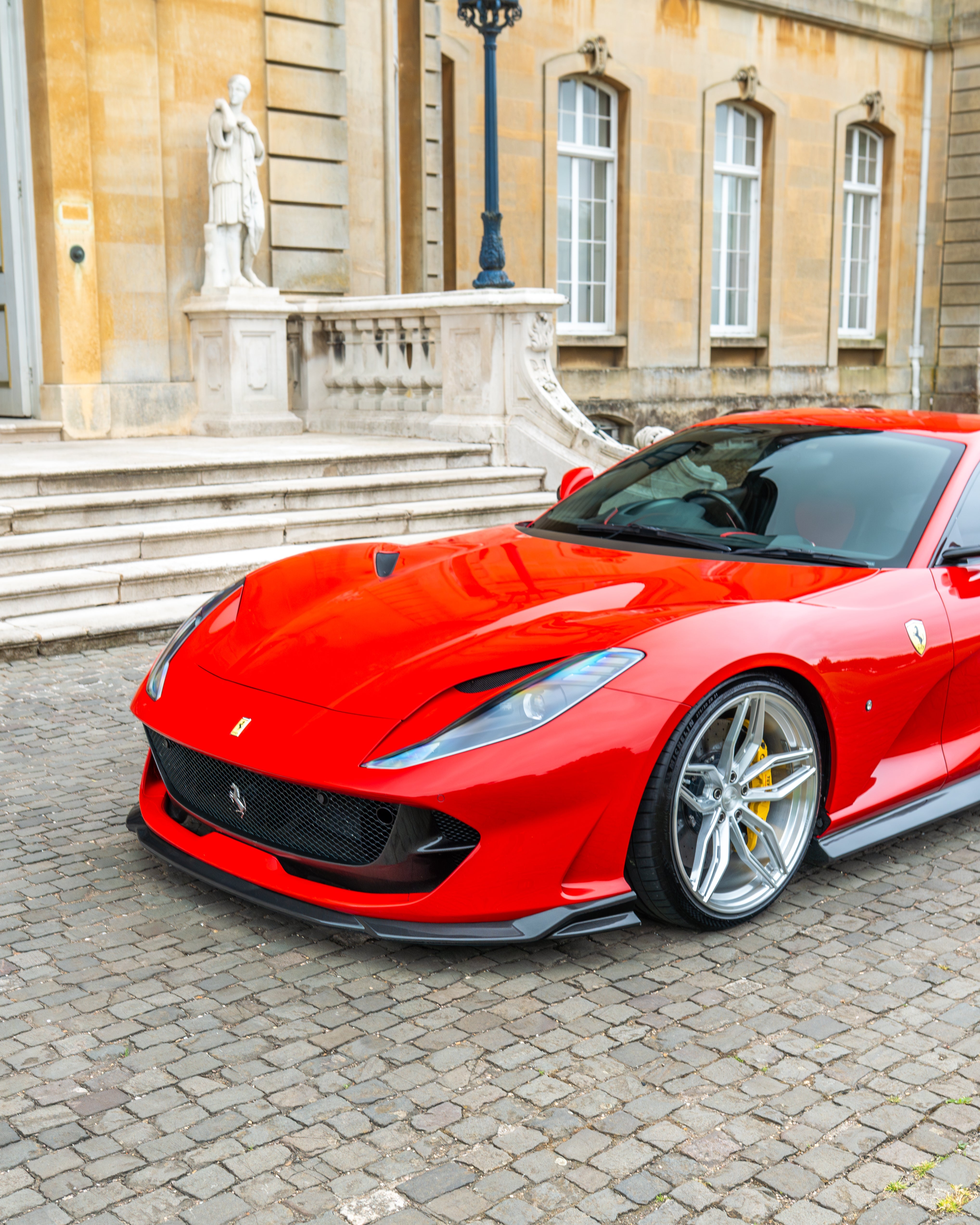 Ferrari 812 Superfast carbon fibre kit by CT Carbon, featuring a splitteer and aerodynamic enhancements on the car's front.