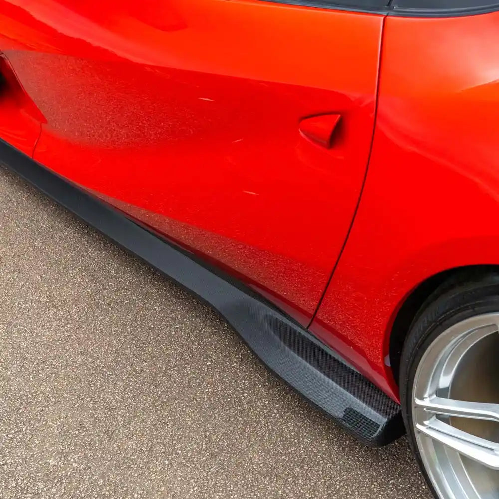 Ferrari 812 Superfast and GTS carbon fibre side skirt extension by CT Carbon, showing sleek aerodynamic design and textured finish.