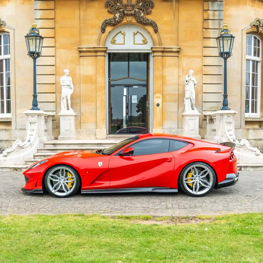 Ferrari 812 Superfast & GTS carbon fibre side skirt extension by CT Carbon, showcasing sleek, aerodynamic design and textured surface.