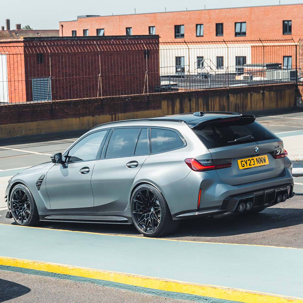 BMW G81 M3 Touring full carbon fibre kit by CT Carbon, showing the lightweight, glossy carbon parts on the car.