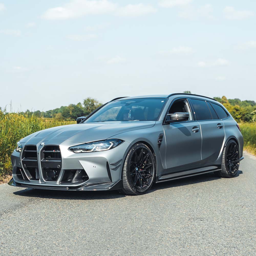 BMW G81 M3 Touring carbon fibre kit by CT Carbon, showing the full car exterior with lightweight, glossy carbon fiber panels.
