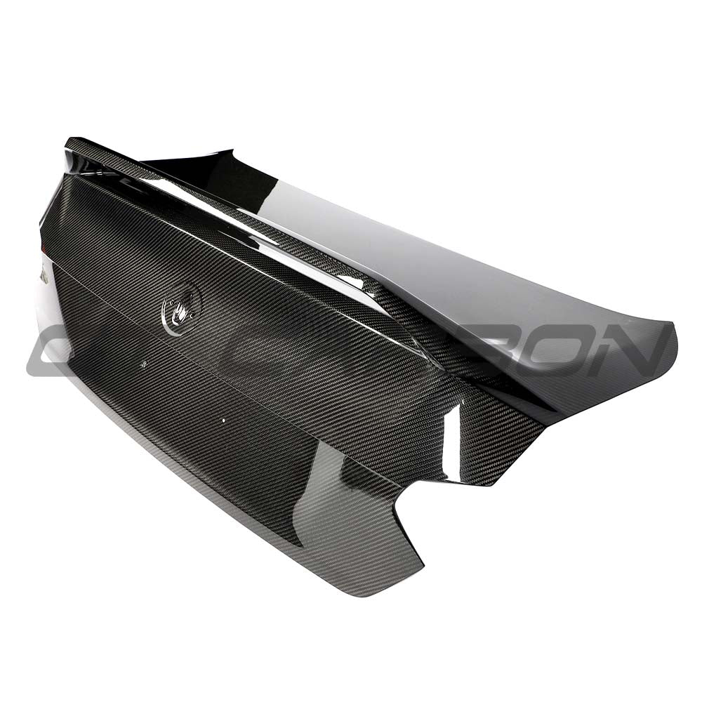 BMW G87 M2 CT Carbon full car conversion kit featuring carbon fiber components, shown on a sleek car in the image.