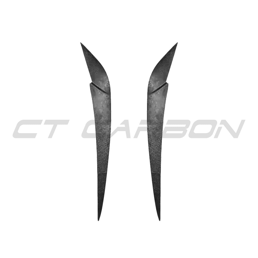 BMW M3 and M4 G8X carbon fiber headlight eyebrow accessory by CT Carbon, showcasing sleek, lightweight design for enhanced vehicle styling.