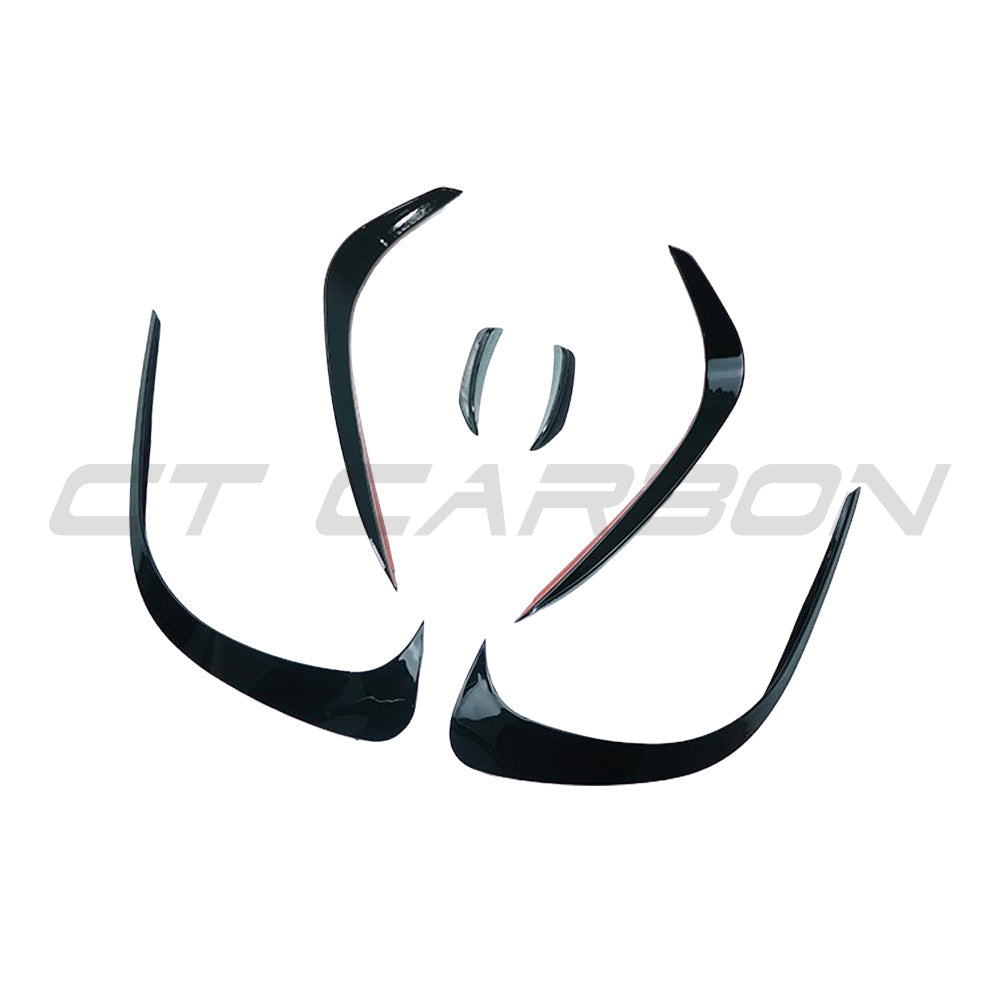 Mercedes W206 2021+ C-Class gloss black front bumper trim by CT Carbon, close-up view showing sleek, high-quality design.