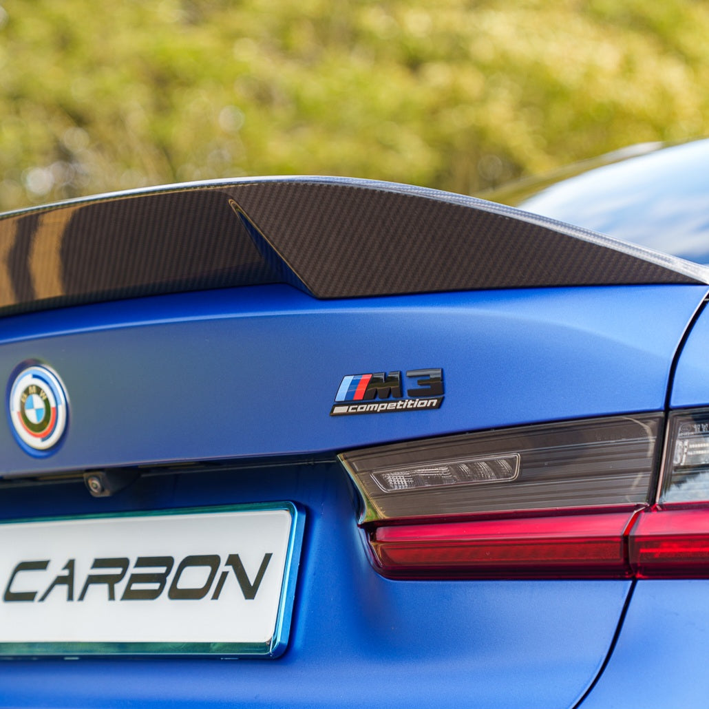 BMW G80 M3 and G20 3 Series carbon fibre spoiler by CT Carbon, showcasing sleek aerodynamic design and high-quality finish.
